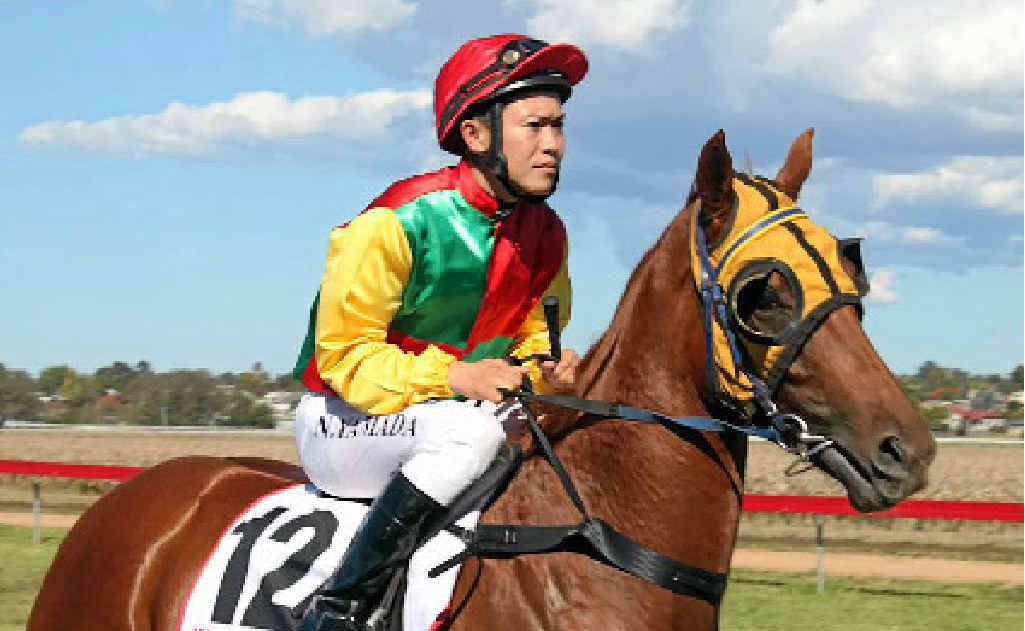 Jockey Nori Yamada rides Soaring Angel in race 2 at the Warwick Picnic Races at Allman Park on Saturday.